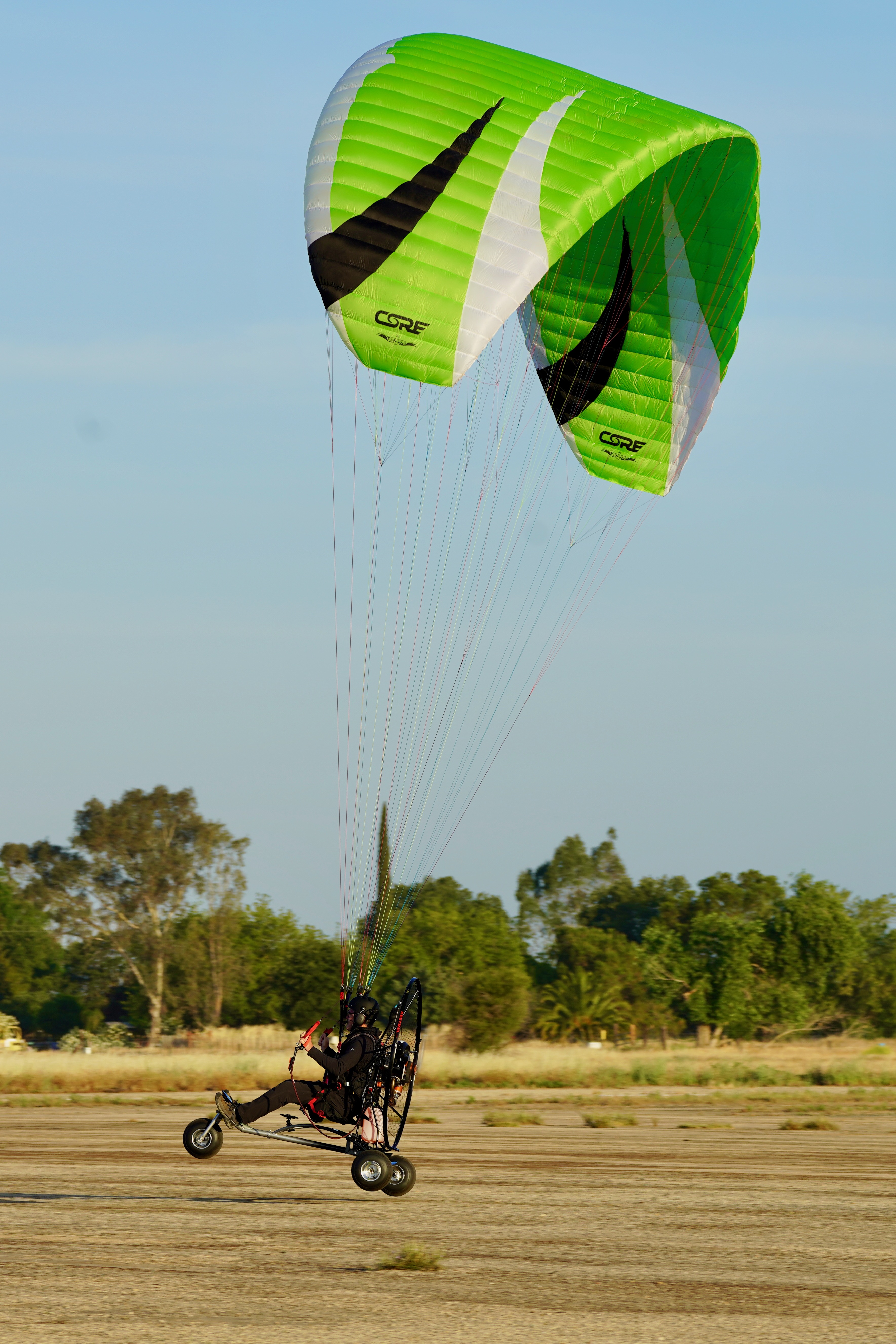Powered paraglider (PPG) flying at Lincoln Powered Parachute Field near Sacramento, California