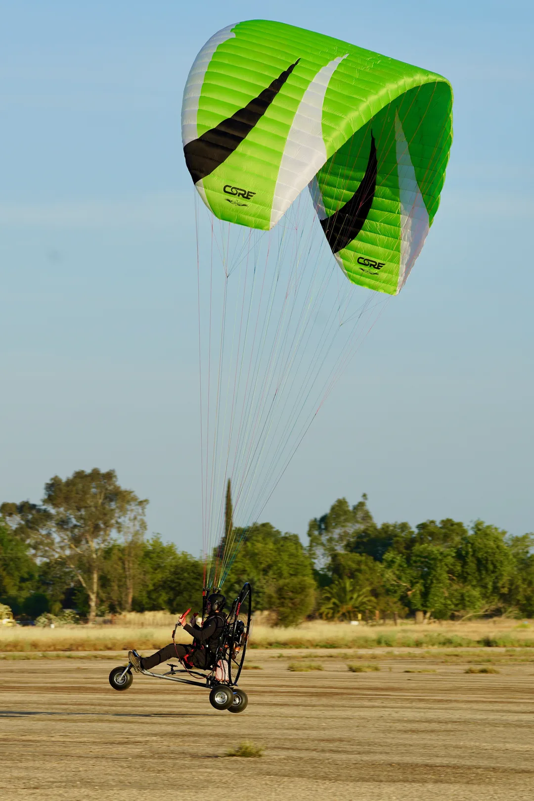 Powered paraglider (PPG) flying at Lincoln Powered Parachute Field near Sacramento, California